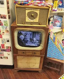  ?? C.J. Lais Jr./times Union ?? Everyone gets in on the act in Seneca Falls, home of the It's a Wonderful Life Museum. Here an old-time TV set plays “It’s a Wonderful Life” on a continuous loop in the showroom of a downtown gift store.