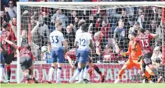  ??  ?? Tottenham Hotspur's French goalkeeper Hugo Lloris (2R) watches the ball into his net as Bournemout­h's Dutch defender Nathan Ake (4L) scores the opening goal during the football match at the Vitality Stadium. — AFP photo