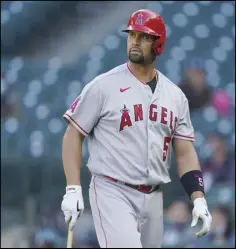  ?? Associated Press ?? ABRUPT EXIT
The Angels’ Albert Pujols walks to the dugout after he was called out on strikes during the ninth inning of a baseball game against the Seattle Mariners on Sunday in Seattle. The Angels cut Pujols abruptly on Thursday, in the final season of his contract.