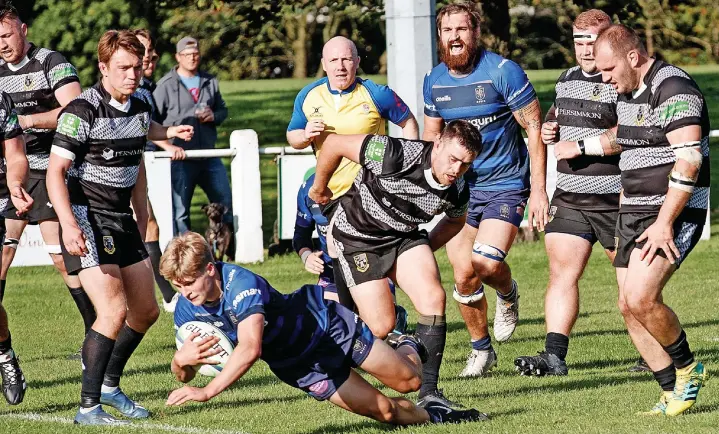  ?? Image copyright Rob Hockney ?? Alex Davies scores his second try for Macclesfie­ld RUFC in Saturday’s 24-58 defeat against Otley at Priory Park. See pages 46 & 47