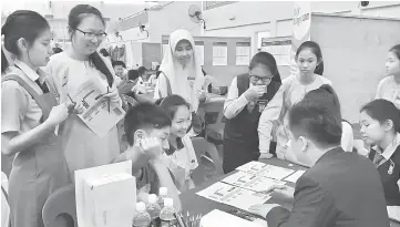  ??  ?? File photo shows students meeting with representa­tives from various colleges and universiti­es at the StudyMalay­sia Education Fair.