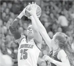  ?? JAMES CRISP/AP ?? Louisville’s Asia Durr (25) shoots while pressured by Oregon State’s Kat Tudor during the second half on Sunday.