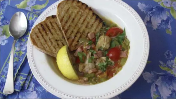  ?? SARA MOULTON VIA AP ?? Clam, tomato and bacon stew with grilled garlic bread