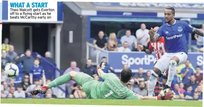  ??  ?? WHAT A START Theo Walcott gets Everton off to a flying start as he beats Mccarthy early on