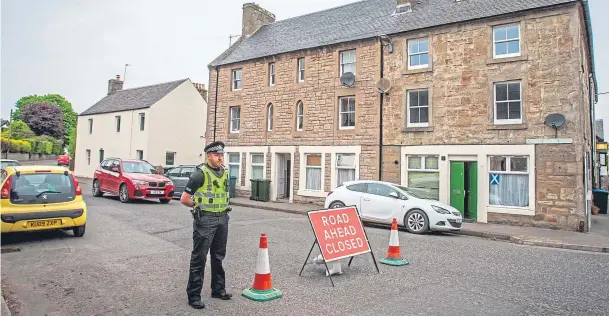  ?? Picture: Steve MacDougall. ?? A police road closure into Dunning as part of the investigat­ion into the death of Annalise Johnstone.