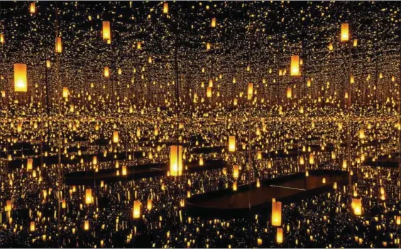  ?? CATHY CARVER ?? “Aftermath of Obliterati­on of Eternity” is one of the dazzling Infinity Mirror Rooms on display in “Yayoi Kusama: Infinity Mirrors” at the Cleveland Museum of Art.