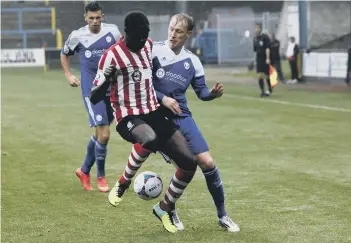  ??  ?? SCOTT BODEN competes for the ball during Town’s 3-2 win.
Pictures by Jim Fitton.