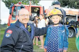  ??  ?? Senior firefighte­r Steve Hennum of the Te Puke Volunteer Fire Brigade with Helen Marshment.