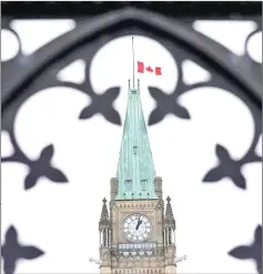  ??  ?? The Canadian flag flies at half-mast on the Peace Tower in memory of the victims of the mosque attacks in New Zealand, on Parliament Hill in Ottawa, Ontario, Canada. — Reuters photo