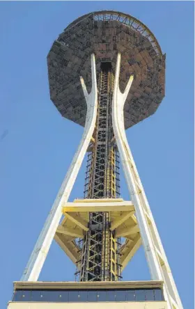  ??  ?? The Space Needle is a 605-foot tripod with a disc and spire on top and was built as the centerpiec­e of the World’sFair of 1962.