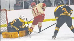  ?? JASON SIMMONDS/JOURNAL PIONEER ?? A&S Scrap Metal Metros Metros goaltender Sam Walsh stopped the Western Red Wings Jason Gallant on this first-period scoring chance in Game 3 of the best-of-seven Island Junior Hockey League final as Alex Hall hustles back on defence.