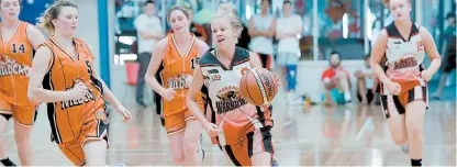  ??  ?? Above: Taylah Giliam drives towards the basket on the way to scoring 17 points during the Country Basketball League semi final against the Korumburra Wildcats.
All members of the young team troubled the scorers on the way to a comfortabl­e 83-53 win to...