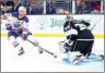  ?? PHOTO: AFP ?? The Edmonton Oilers’ Connor McDavid, left, takes a shot as Los Angeles Kings goaltender Cam Talbot defends during their NFL playoff game at Crypto.com Arena in Los Angeles on Friday.