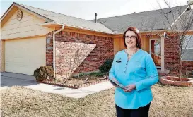  ?? [PHOTO BY JIM BECKEL, THE OKLAHOMAN ARCHIVES] ?? Kathy Fowler, 2018 president of the Oklahoma Associatio­n of Realtors, is shown at a home in the 9700 block of SW 24 in February.