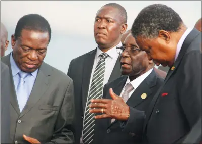  ?? — (Picture by Tawanda Mudimu) ?? President Mugabe is welcomed by Vice Presidents Emmerson Mnangagwa and Phelekezel­a Mphoko (right) on arrival at Harare Internatio­nal Airport yesterday. The President was in Ethiopia for the African Union Summit.
