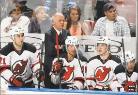  ?? Joel Auerbach / Associated Press ?? Former Devils president/general manager Lou Lamoriello looks on during the a game against the Florida Panthers in 2015. Lamoriello is set to join the Islanders.