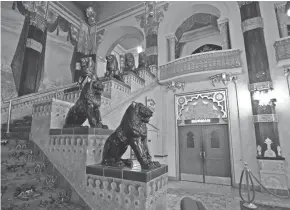  ?? MIKE DE SISTI / MILWAUKEE JOURNAL SENTINEL ?? Statues of lions line the stairway to the second floor and balcony of the Oriental Theatre, 2230 N. Farwell Ave. See more photos and a video at jsonline.com/news.