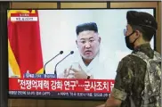  ?? AHN YOUNG-JOON / AP ?? A South Korean army soldier passes by a TV showing a file image of North Korean leader Kim Jong Un during a news program at the Seoul Railway Station in Seoul, South Korea, on Wednesday.
