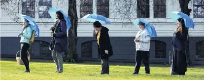  ?? PHOTO: GERARD O’BRIEN ?? Whale sounds . . . Artist Vicki Smith (far left) took people on a Sounding Walks tour through a ‘‘WiFiocean’’ yesterday. She is pictured with members of the public, from left, ‘‘Miro’’, Vicki Lenihan and Rai McCaw, and coorganise­r Otago Polytechni­c...