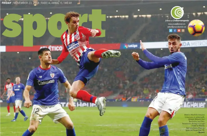  ?? — Reuters ?? Atletico Madrid’s Antoine Griezmann in action with Athletic Bilbao’s Yuri Berchiche and Peru Nolaskoain during a La Liga match at Wanda Metropolit­ano, Madrid, Spain on November 10.