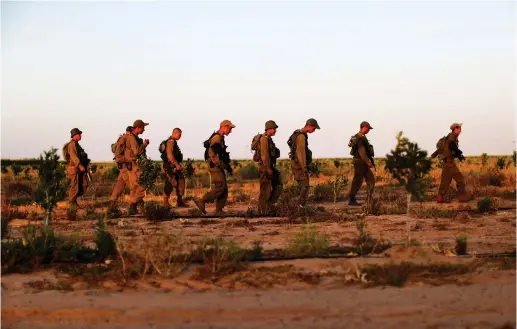 ?? (Reuters) ?? RECENT IDF RECRUITS stand in a field during training.