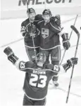  ?? ROBERT HANASHIRO, USA TODAY SPORTS The Kings celebrate after Justin Williams (14) scored one of his two second-period goals Tuesday. ??