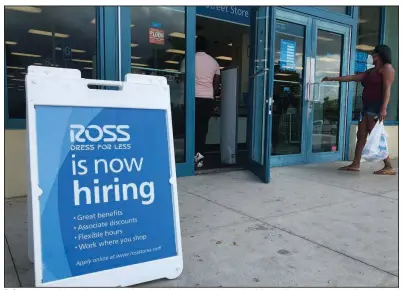  ?? (AP/Wilfredo Lee) ?? A sign announces job openings outside a Ross Dress for Less store in North Miami Beach, Fla. earlier this month. The number of laid-off workers seeking unemployme­nt benefits last week was 1.3 million, the Labor Department reported.