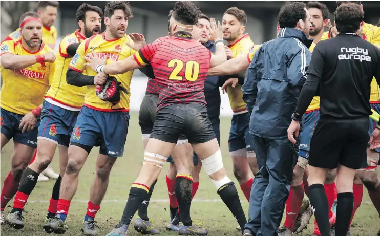  ?? — AP FILES ?? Spain’s players, left, clash with Romanian referee Vlad Iordachesc­u after the Rugby Europe Championsh­ip match with Belgium in Brussels earlier this month.