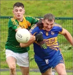  ??  ?? Cathal Doyle in a tussle with 50-year-old veteran John Roche.