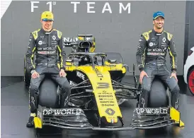  ?? /AFP ?? Ready to go: Renault drivers Daniel Ricciardo, right, Esteban Ocon with their new car. A Q&A session scheduled with the media on Wednesday was cancelled.