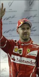  ?? LUCA BRUNO, THE ASSOCIATED PRESS ?? Ferrari driver Sebastian Vettel of Germany waves to supporters after the Emirates Grand Prix in Abu Dhabi.