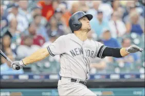  ?? Paul Sancya / Associated Press ?? the Yankees’ Brett Gardner hits a solo home run against the tigers in the second inning. Both he and teammate didi Gregorius homered twice.