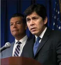 ?? RICH PEDRONCELL­I ?? In this Sept. 5, 2017 photo, State Senate President Pro Tem Kevin de Leon, D-los Angeles, right, flanked by Secretary of State Alex Padilla, answers questions at a news conference in Sacramento. California Gov. Jerry Brown signed de Leon’s SB54, the...