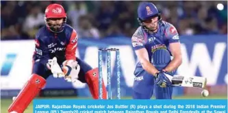  ??  ?? JAIPUR: Rajasthan Royals cricketer Jos Buttler (R) plays a shot during the 2018 Indian Premier League (IPL) Twenty20 cricket match between Rajasthan Royals and Delhi Daredevils at the Sawai Mansingh Stadium in Jaipur yesterday. — AFP