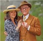  ??  ?? This file photo shows Sir John Hurt posing with his wife Anwen after being awarded a knighthood by Queen Elizabeth II during an Investitur­e ceremony at Windsor Castle. — AFP