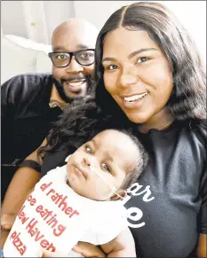  ?? Peter Hvizdak / Hearst Connecticu­t Media ?? Ari Williams, 10 months, with her father, Andre Williams, and mother, Taryn Bonner-Williams, was born premature at 26 weeks and spent nearly 10 months in the hospital.