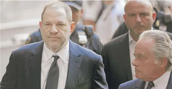  ?? SETH WENIG/ AP ?? HarveyWein­stein and attorney Ben Brafman ( right) arrive at court in New York on Tuesday. Weinstein was indicted last week.