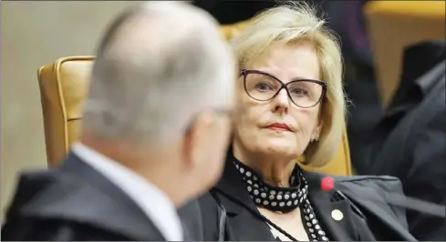  ?? VICTORIA SILVA/AFP ?? Brazilian Supreme Court Judge Rosa Weber (right) attends a session to rule on whether former president Luiz Inacio Lula da Silva should start a 12 year prison sentence for corruption at the Supreme Court in Brasilia, on Wednesday.