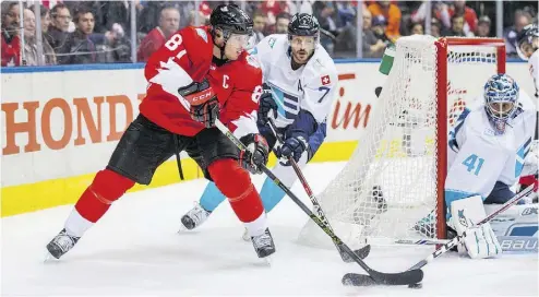  ?? ERNEST DOROSZUK / POSTMEDIA NETWORK ?? Team Canada’s Sidney Crosby, left, might have helped linemate Brad Marchand get a US$49-million contract this week.