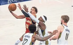  ?? TREVOR RUSZKOWSKI/USA TODAY SPORTS ?? Atlanta’s Trae Young scored 30 points, but it wasn’t enough to lift the Hawks by the Pacers, who ended a three-game home skid.