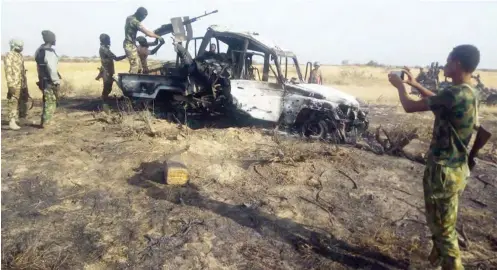  ?? PHOTO: ?? A Boko Haram’s anti-aircraft gun truck that was damaged when Boko Haram members attacked troops of the 118 Battalion in Arege, Borno State. The troops captured one-gun truck, three anti-aircraft guns, two AK- 47 rifles, one RPG bomb and some mortar bombs, while three-gun trucks were burnt Army headquarte­rs