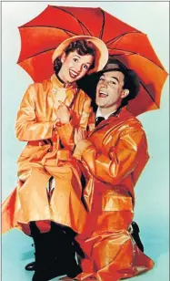  ?? Picture: AFP ?? DOUBLE TRAGEDY: Debbie Reynolds with 1952 ‘Singin’ in the Rain’ co-star Gene Kelly, who died in 1996. Reynolds, who tap-danced her way into hearts as a star of Hollywood’s golden age, died on Wednesday, grief-stricken over daughter Carrie Fisher’s...