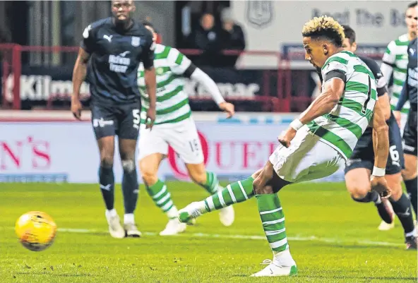  ?? Picture: SNS Group. ?? Scott Sinclair strokes home a first-half penalty to put Brendan Rodgers’ side 2-0 ahead at Dens.