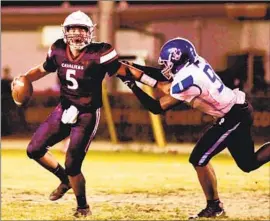  ?? Steve Galluzzo For The Times ?? CLEVELAND QUARTERBAC­K Emiliano Lopez tries to escape Palisades defensive end Immanuel Robinson during the Cavaliers’ 34-14 win to remain unbeaten.