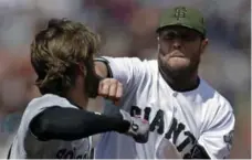  ?? BEN MARGOT/THE ASSOCIATED PRESS ?? Washington’s Bryce Harper and San Francisco’s Hunter Strickland, who fought in Monday’s game, have history dating back to the 2014 playoffs.