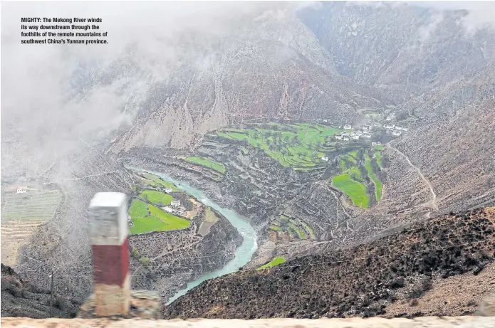  ??  ?? MIGHTY: The Mekong River winds its way downstream through the foothills of the remote mountains of southwest China’s Yunnan province.