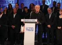  ?? (Adrian Sebal) ?? YESH ATID leader Yair Lapid announces his party list yesterday at an event in Shefayim.