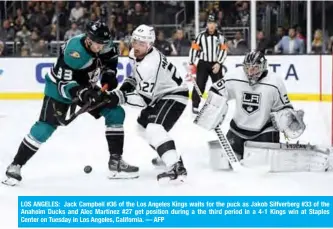  ??  ?? LOS ANGELES: Jack Campbell #36 of the Los Angeles Kings waits for the puck as Jakob Silfverber­g #33 of the Anaheim Ducks and Alec Martinez #27 get position during a the third period in a 4-1 Kings win at Staples Center on Tuesday in Los Angeles, California. — AFP