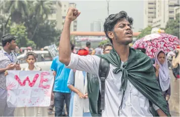  ?? EPA ?? A Bangladesh­i student shouts slogans during a rally demanding safe roads in the country. Protests have been taking place since the death of two college students who were killed in an accident caused by a speeding bus in Dhaka.