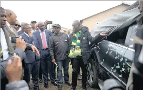  ?? PICTURE: BONGANI MBATHA ?? Police Minister Fikile Mbalula, MEC for Community Safety Mxolisi Kaunda, Zenzele Msomi and Les Sthutha inspect the car in which former ANC Youth League leader Sindiso Magaqa was shot and wounded in Umzimkhulu in July. Magaqa, whose funeral was held in...